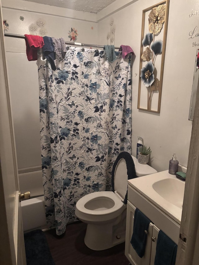 1907 Helm Ave, North Charleston, SC 29405 - bathroom with vanity, wood finished floors, toilet, and shower / bathtub combination with curtain