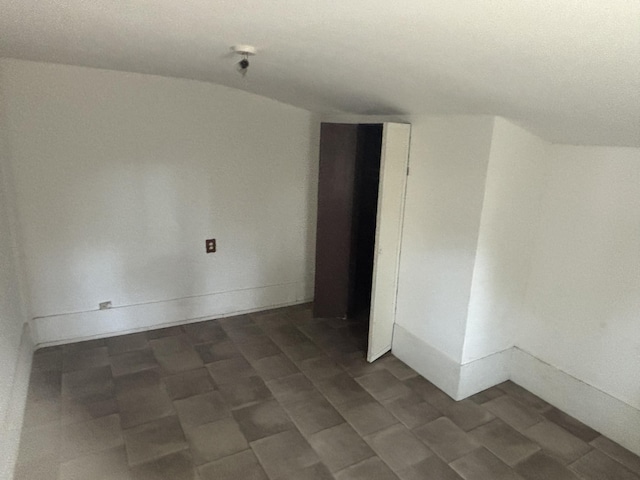 1907 Helm Ave, North Charleston, SC 29405 - empty room with baseboards and lofted ceiling