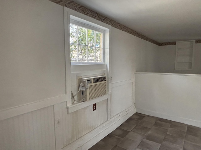 1907 Helm Ave, North Charleston, SC 29405 - spare room with a decorative wall, cooling unit, and a wainscoted wall