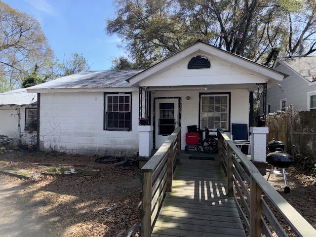 1907 Helm Ave, North Charleston, SC 29405 - view of front facade with covered porch, concrete block siding, and metal roof