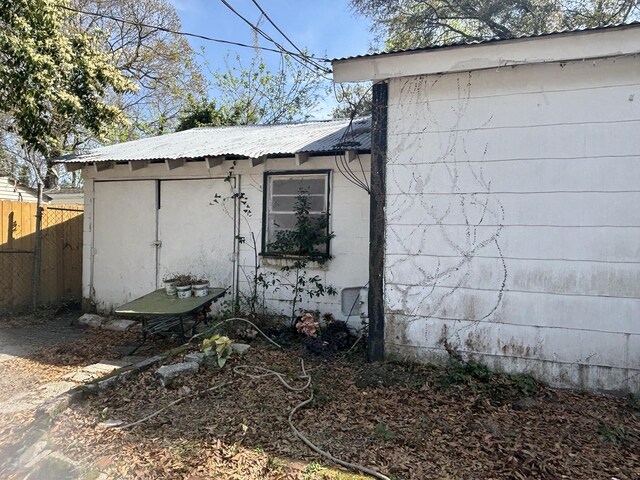 1907 Helm Ave, North Charleston, SC 29405 - view of side of home featuring metal roof and fence