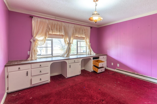 unfurnished office featuring baseboard heating, crown molding, a textured ceiling, dark colored carpet, and built in desk