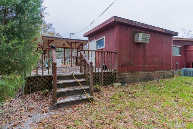 view of side of property with central air condition unit