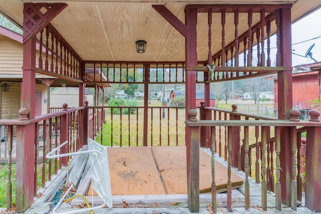 wooden terrace with an outbuilding and an exterior structure