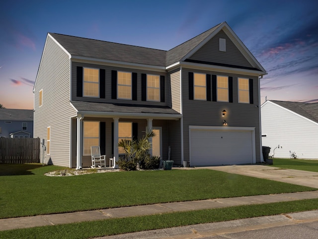 view of front facade featuring a yard and a garage