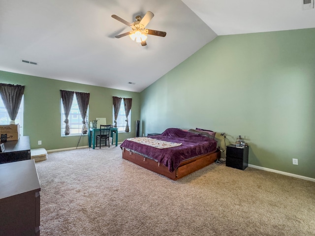 bedroom with ceiling fan, carpet flooring, and vaulted ceiling