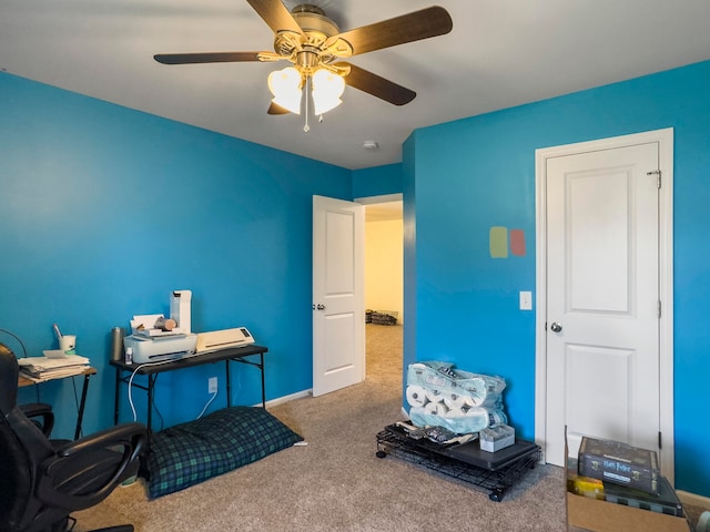 interior space with carpet floors and ceiling fan