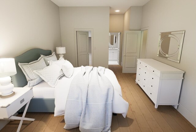 bedroom with light wood-type flooring, connected bathroom, and recessed lighting