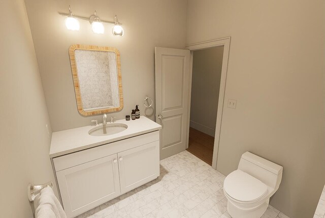 bathroom with vanity and toilet