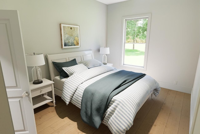 bedroom with light wood-type flooring