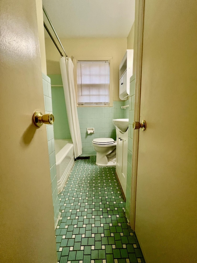 bathroom featuring tile patterned flooring, tile walls, shower / bath combination with curtain, and toilet