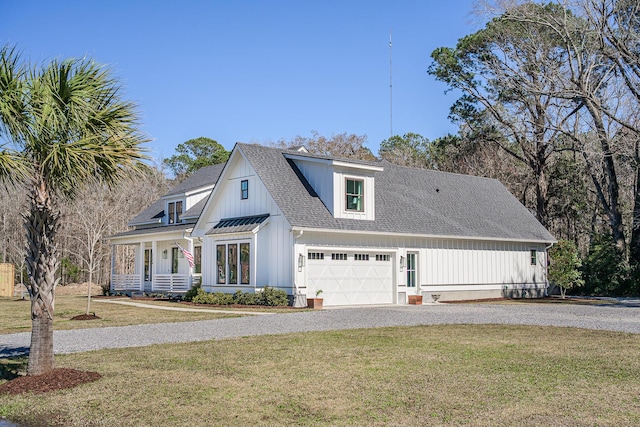 view of front of property featuring a front lawn, a garage, and a shingled roof