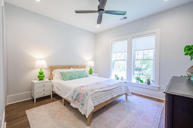 bedroom featuring visible vents, dark wood-type flooring, a ceiling fan, recessed lighting, and baseboards