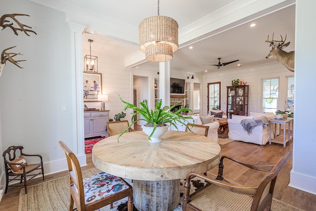 dining room featuring recessed lighting, ceiling fan with notable chandelier, baseboards, and wood finished floors