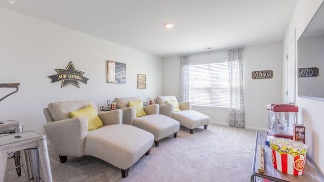 living area with light colored carpet