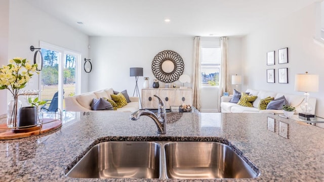 kitchen with stone countertops and sink