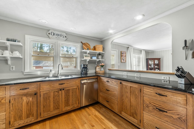 kitchen featuring dishwasher, ornamental molding, sink, and a wealth of natural light