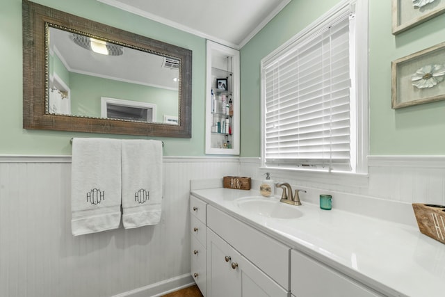 bathroom featuring vanity and ornamental molding