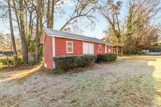 view of outdoor structure with a carport