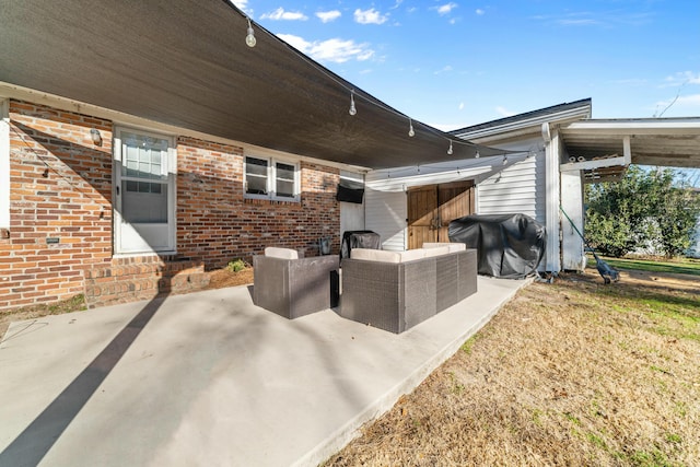 view of patio with grilling area and an outdoor living space