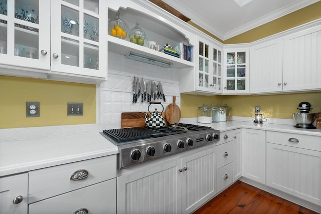 kitchen featuring white cabinets, stainless steel gas cooktop, crown molding, and dark hardwood / wood-style floors