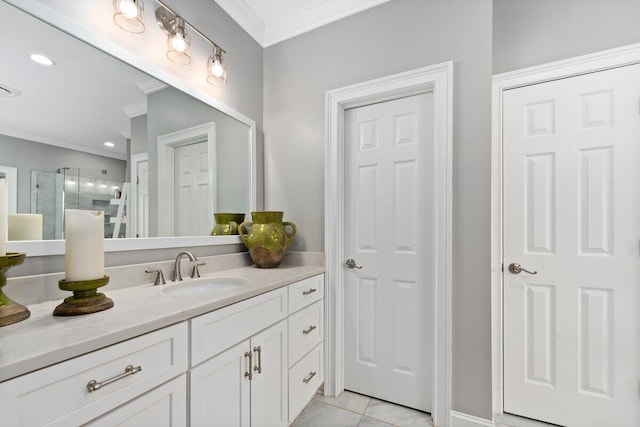 bathroom with ornamental molding, tile floors, and large vanity