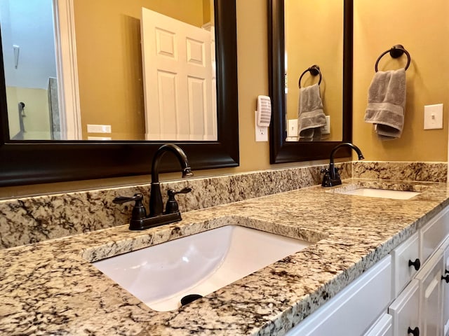 bathroom featuring dual vanity