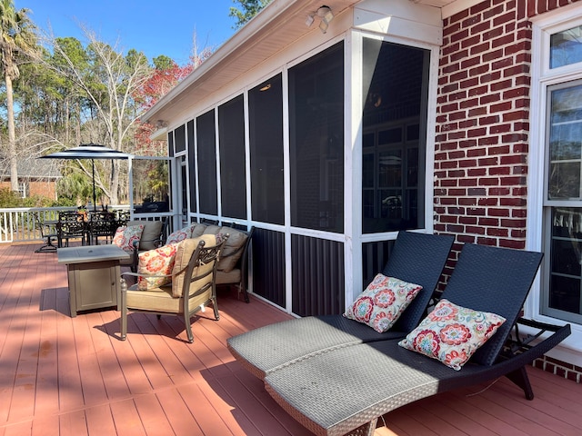 deck with a sunroom