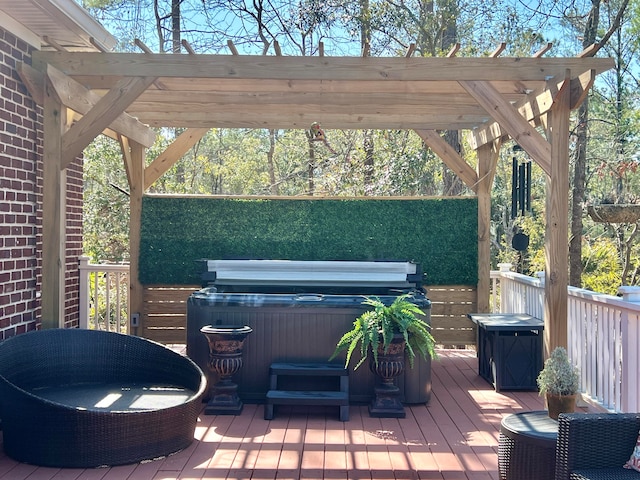 deck with a hot tub and a pergola