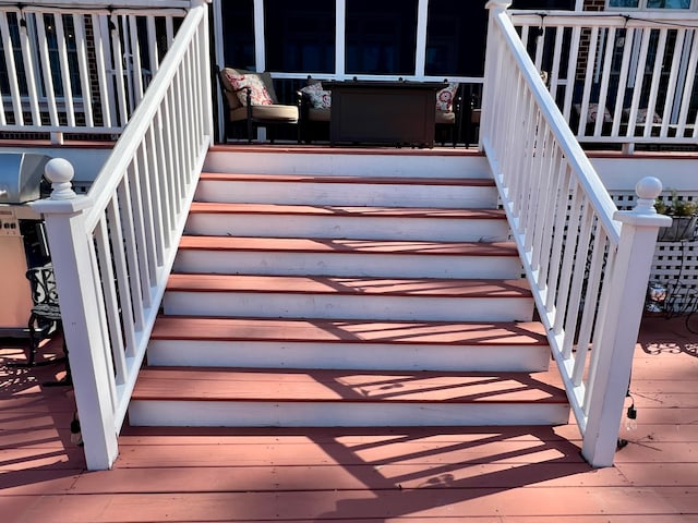 stairway with light wood-type flooring