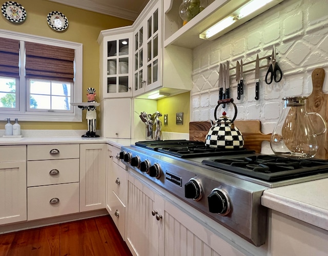 kitchen featuring white cabinets, dark hardwood / wood-style floors, and stainless steel gas cooktop