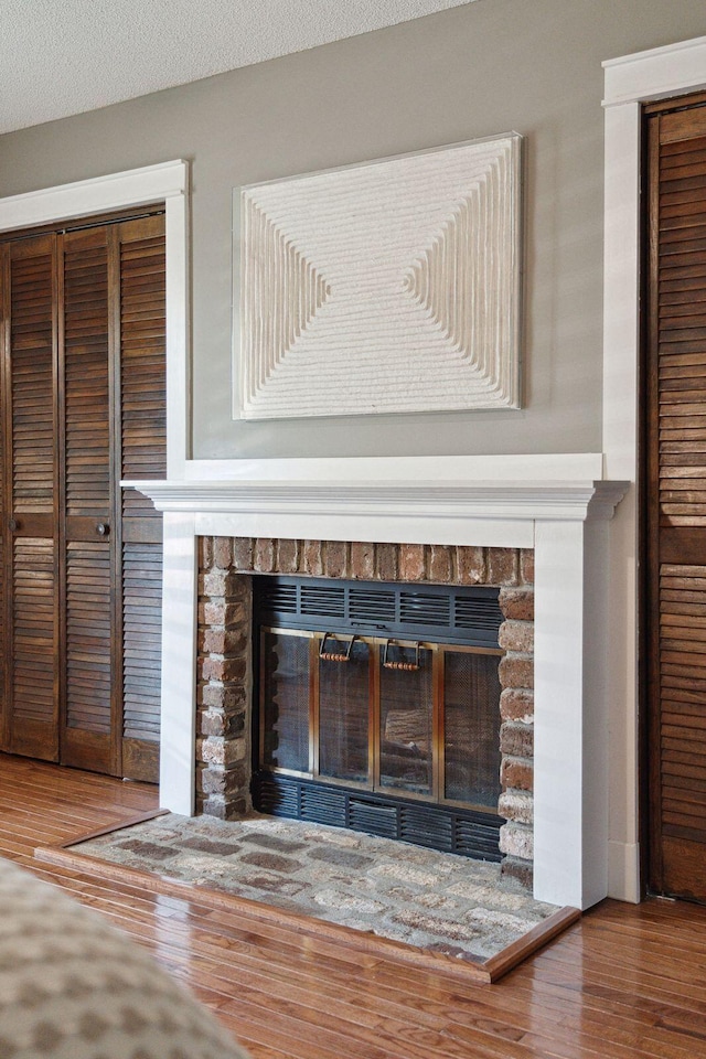 room details featuring wood finished floors and a fireplace