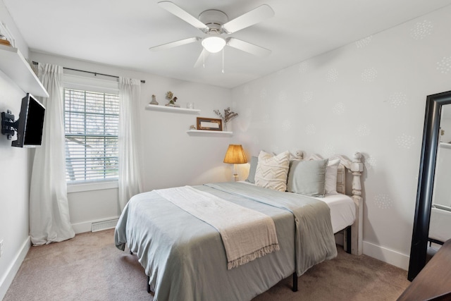 carpeted bedroom with visible vents, baseboards, and ceiling fan