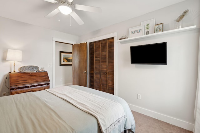 bedroom featuring a ceiling fan, carpet flooring, baseboards, and a closet