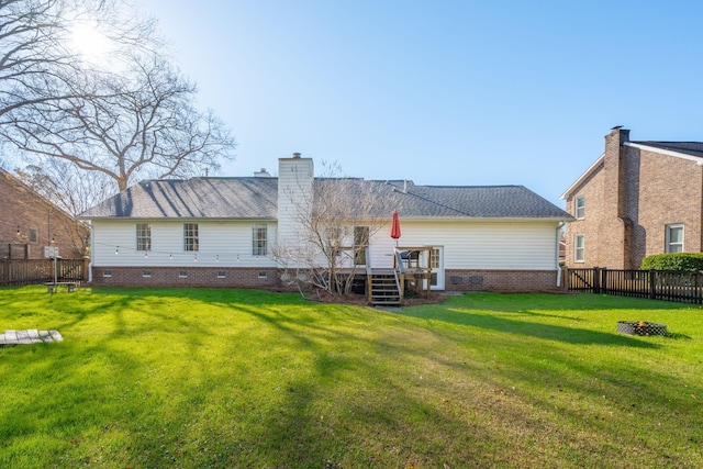 back of house with a yard, crawl space, a fenced backyard, and a deck