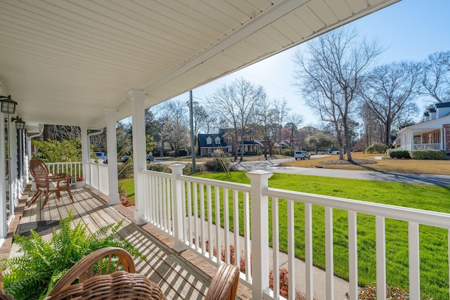 exterior space featuring a porch and a residential view