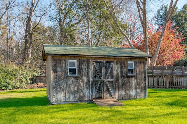 view of shed with fence