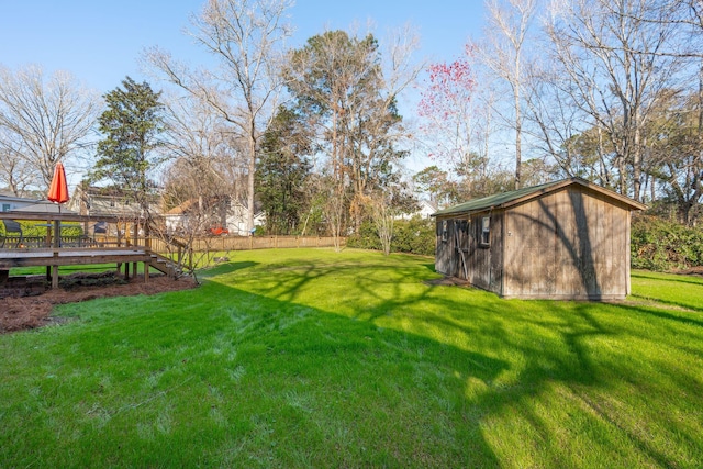 view of yard with a storage shed and an outbuilding