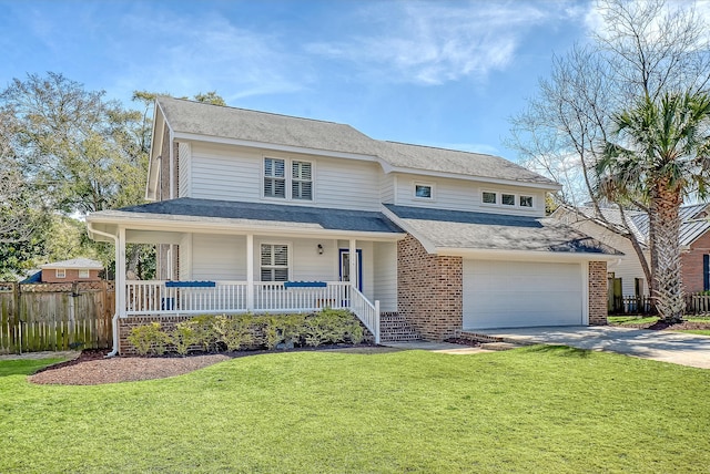 view of front of house with brick siding, covered porch, fence, driveway, and a front lawn