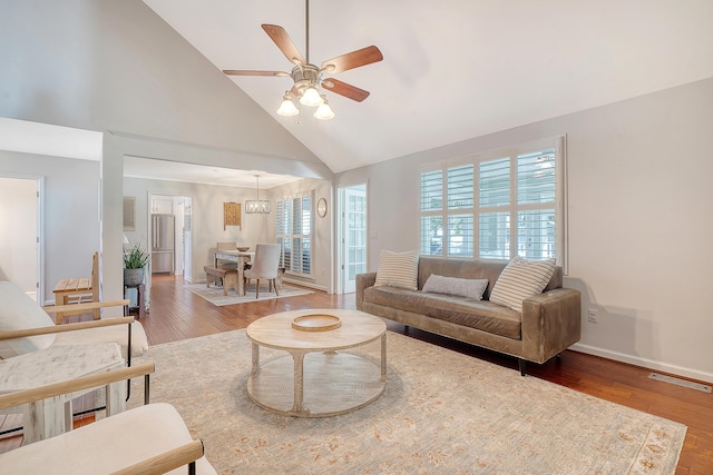 living room with a healthy amount of sunlight, visible vents, and wood finished floors