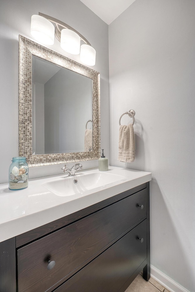 bathroom with vanity and baseboards