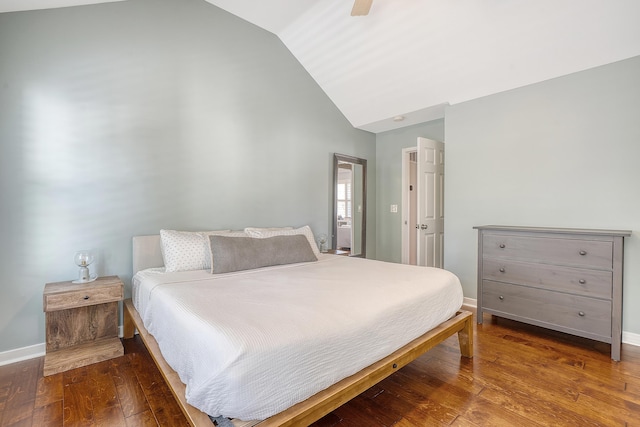 bedroom featuring hardwood / wood-style flooring, ceiling fan, baseboards, and vaulted ceiling