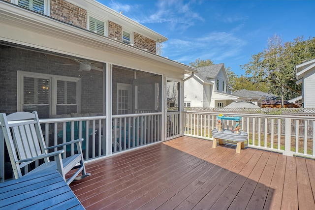 wooden terrace featuring a sunroom