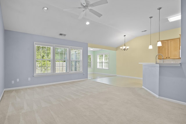 261 Sweet Alyssum Dr, Ladson, SC 29456 - unfurnished living room featuring lofted ceiling, light colored carpet, baseboards, ceiling fan, and a chandelier