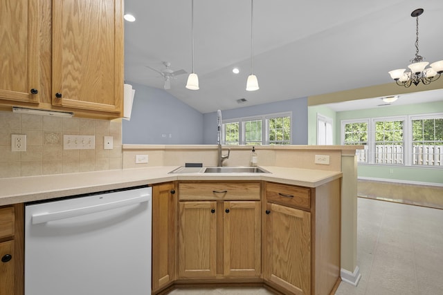 261 Sweet Alyssum Dr, Ladson, SC 29456 - kitchen featuring white dishwasher, a peninsula, vaulted ceiling, tasteful backsplash, and light countertops