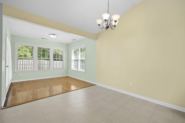 261 Sweet Alyssum Dr, Ladson, SC 29456 - empty room with a chandelier, baseboards, vaulted ceiling, and wood finished floors