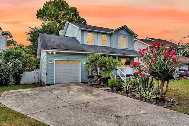 721 Lake Frances Dr, Charleston, SC 29412 - traditional home featuring covered porch, a garage, driveway, and roof with shingles