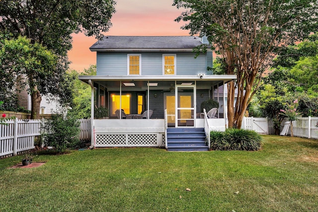721 Lake Frances Dr, Charleston, SC 29412 - rear view of house featuring a sunroom, a fenced backyard, and a gate