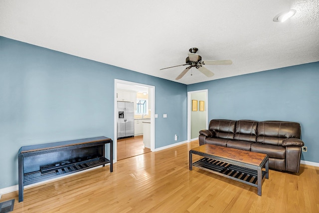 721 Lake Frances Dr, Charleston, SC 29412 - living area featuring a ceiling fan and light wood-style floors