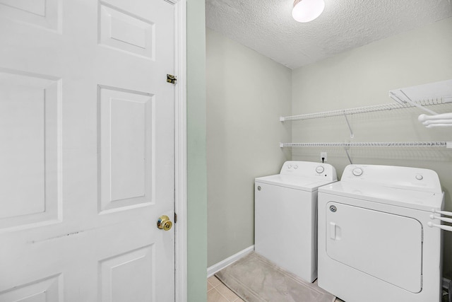 721 Lake Frances Dr, Charleston, SC 29412 - laundry area with washer and clothes dryer, a textured ceiling, and light tile patterned flooring